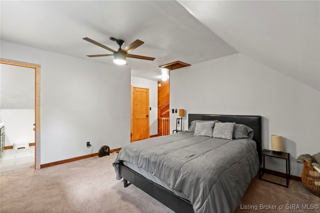 3895 Utz Road Northeast Georgetown, IN 47122 - Photo 25 of 70 Second Upstairs Bedroom – Spacious layout with modern ceiling fan and plush carpet flooring.