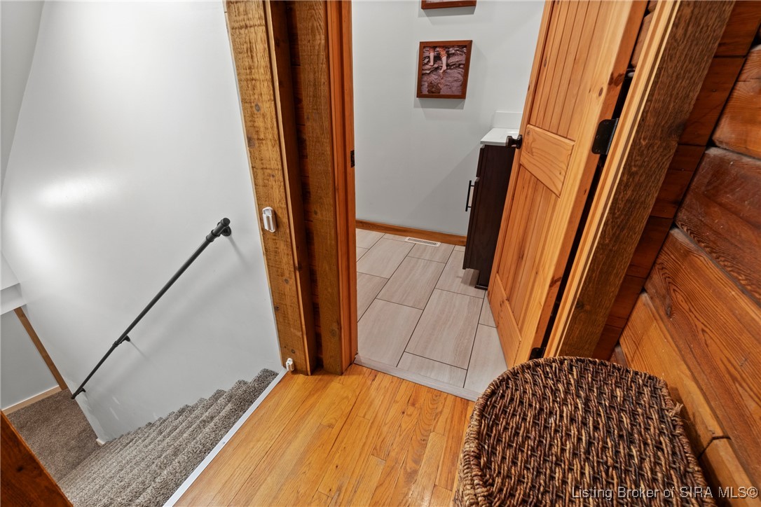 3895 Utz Road Northeast Georgetown, IN 47122 - Photo 29 of 70 Powder Room Entry – Convenient half bath location adjacent to main living areas with tile flooring.