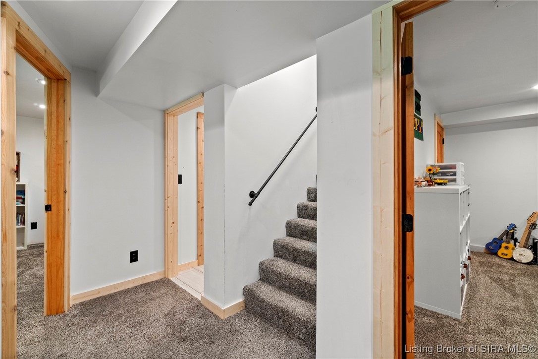 3895 Utz Road Northeast Georgetown, IN 47122 - Photo 32 of 70 Lower-Level Hallway – Provides access to bedrooms, bathroom, and additional storage spaces.