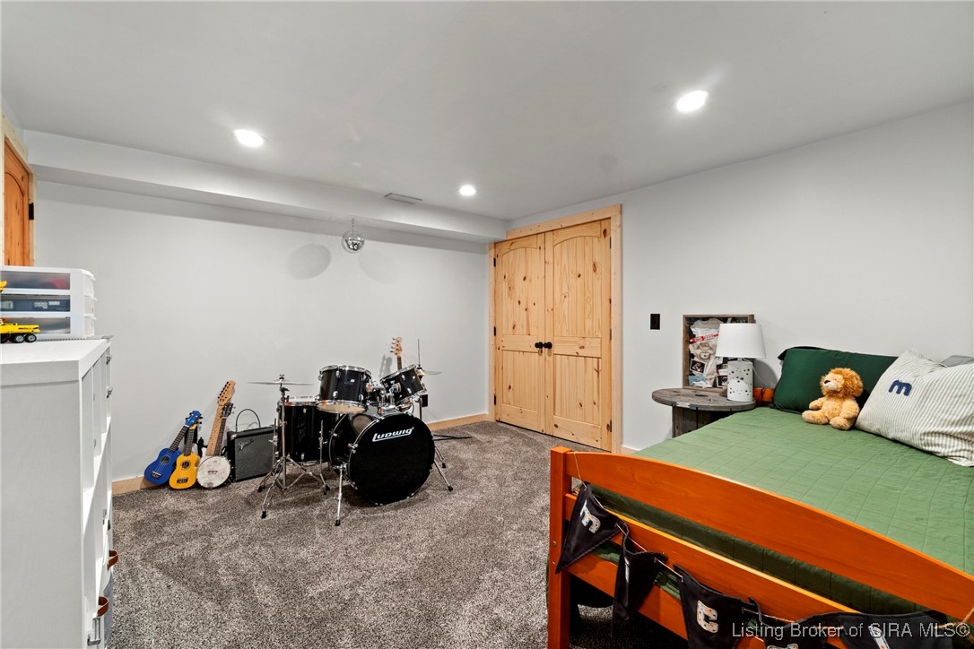 3895 Utz Road Northeast Georgetown, IN 47122 - Photo 33 of 70 Bedroom 3 – Bright and open with neutral tones, plush carpeting, and double-door closet.