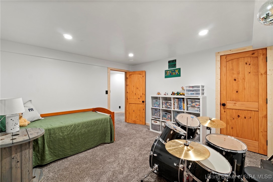 3895 Utz Road Northeast Georgetown, IN 47122 - Photo 34 of 70 Bedroom 3 Alternate View – Highlights versatile space for sleeping or hobbies, complete with recessed lighting.