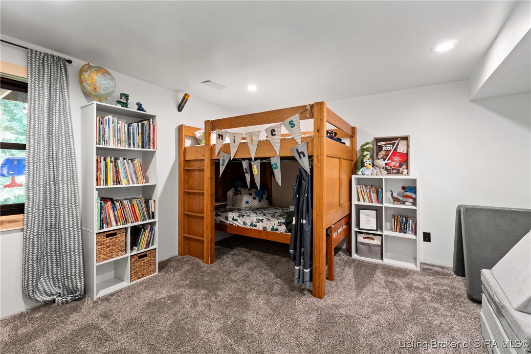 3895 Utz Road Northeast Georgetown, IN 47122 - Photo 35 of 70 Bedroom 4 – Features cozy carpet, window with natural light, and built-in shelving perfect for books or displays.