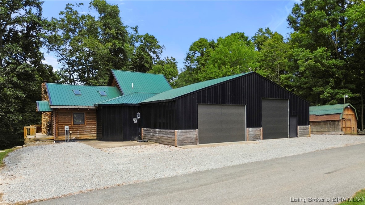 3895 Utz Road Northeast Georgetown, IN 47122 - Photo 42 of 70 Garage/Workshop Side View – Showcases multiple entry points and connection to the main home.