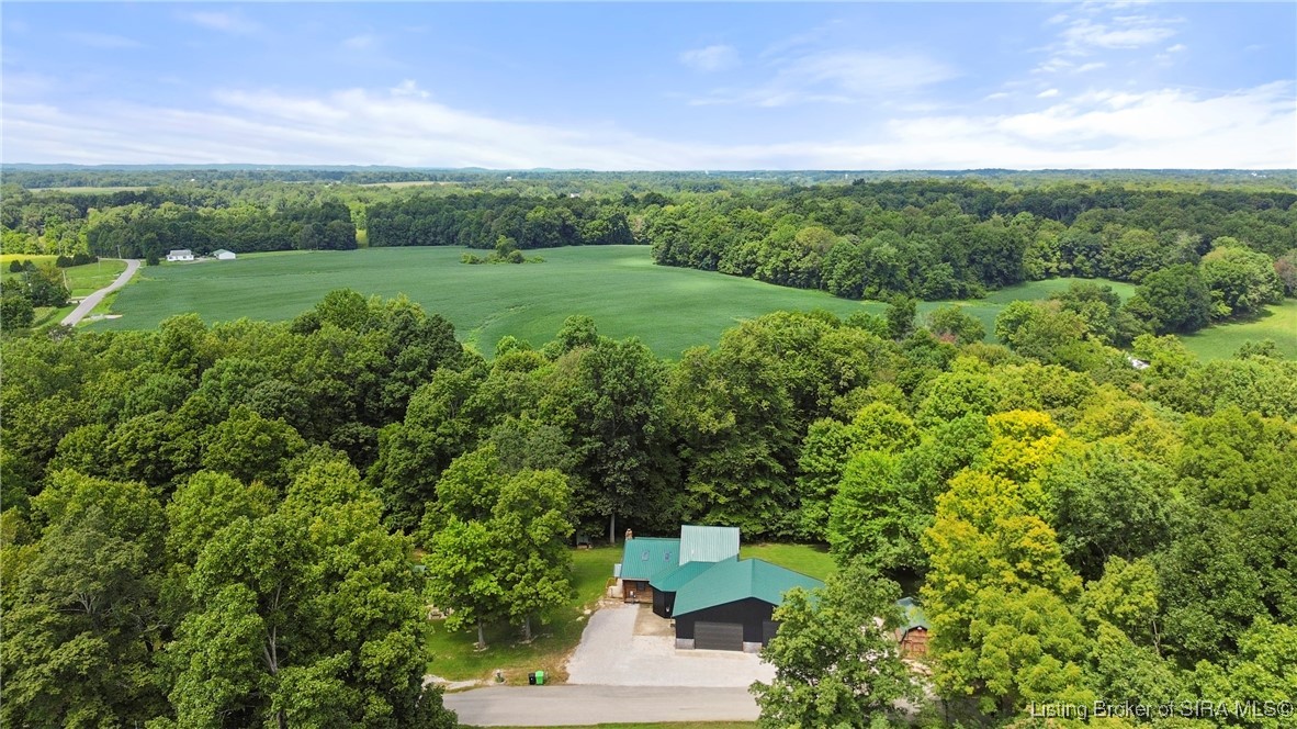 3895 Utz Road Northeast Georgetown, IN 47122 - Photo 45 of 70 Aerial View of Property and Surroundings – Shows expansive wooded acreage and open fields beyond.