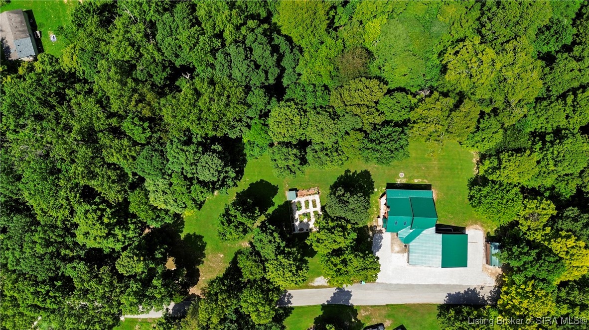 3895 Utz Road Northeast Georgetown, IN 47122 - Photo 48 of 70 Full Overhead View Without Boundaries – Captures the home, gardens, and detached garage surrounded by thick woodland.