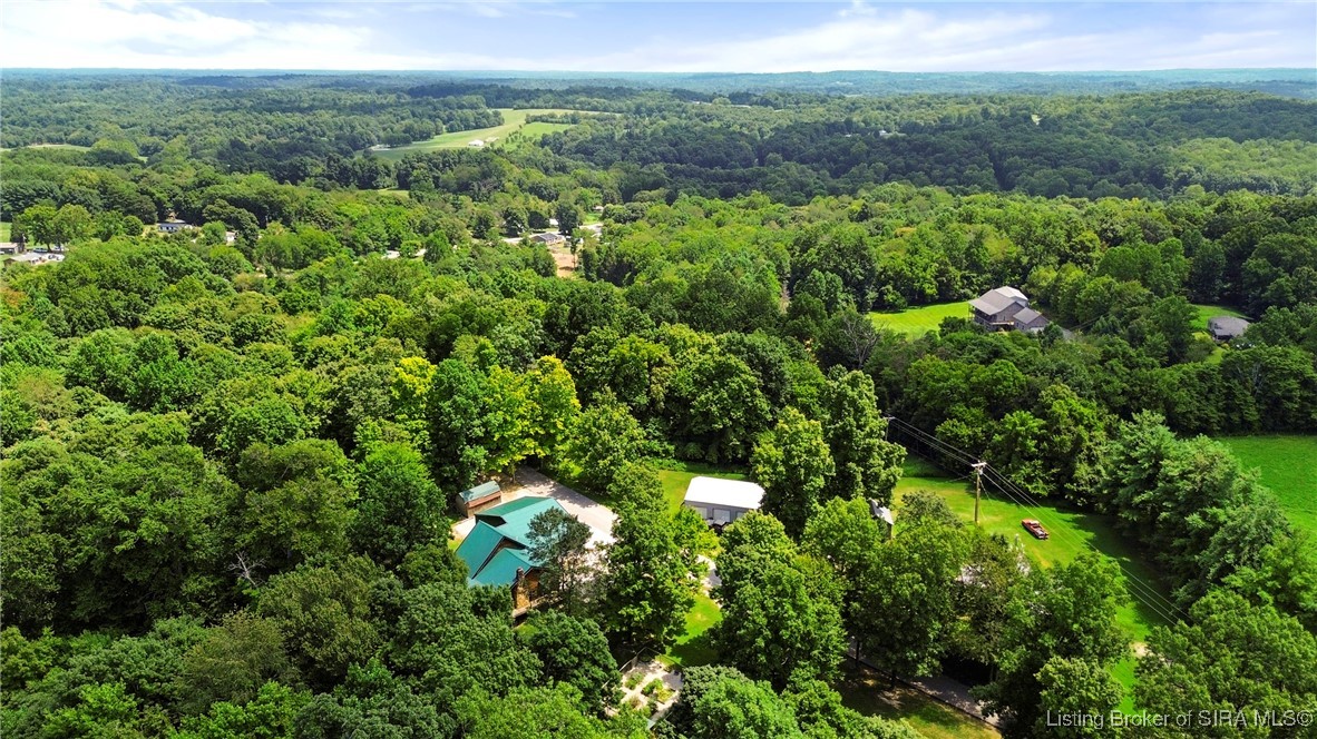 3895 Utz Road Northeast Georgetown, IN 47122 - Photo 51 of 70 Aerial View Looking Across Valley – Expansive view of rolling hills, wooded land, and nearby homes.