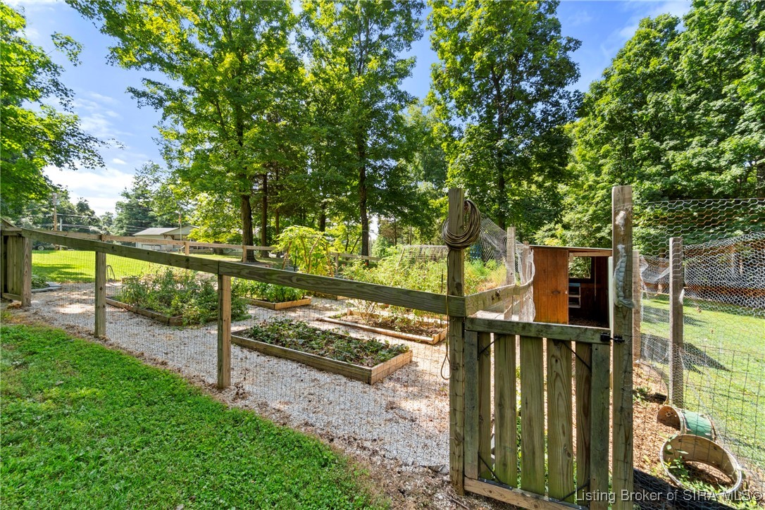 3895 Utz Road Northeast Georgetown, IN 47122 - Photo 58 of 70 Fenced Garden and Chicken Coop – Raised garden beds within a secure fenced enclosure with attached coop.