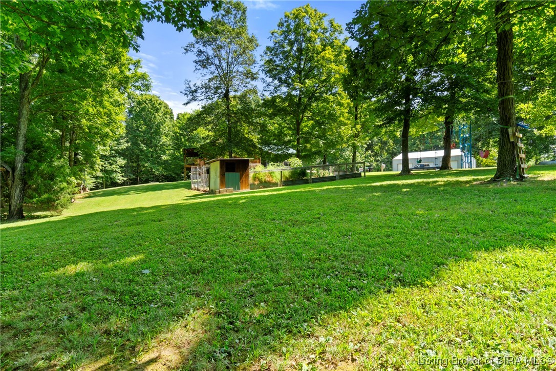 3895 Utz Road Northeast Georgetown, IN 47122 - Photo 59 of 70 Backyard View with Coop – Expansive yard with chicken coop and fenced garden area.