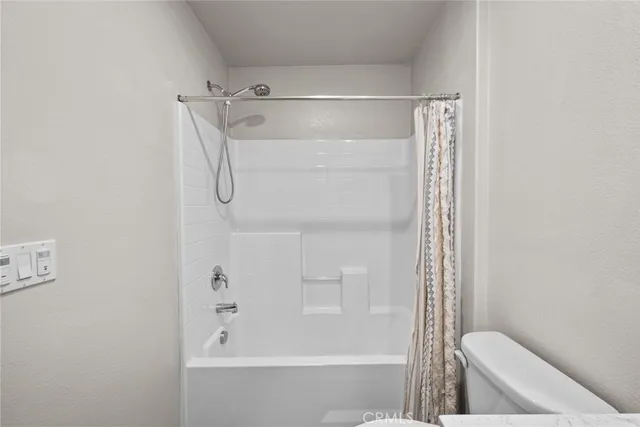 a bathroom with a shower and a bathtub