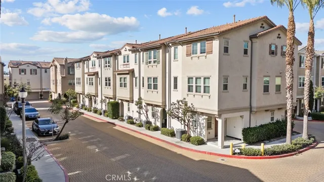 a view of a building with cars windows