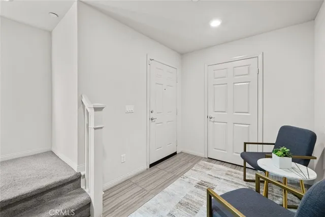 a room with furniture and a rug