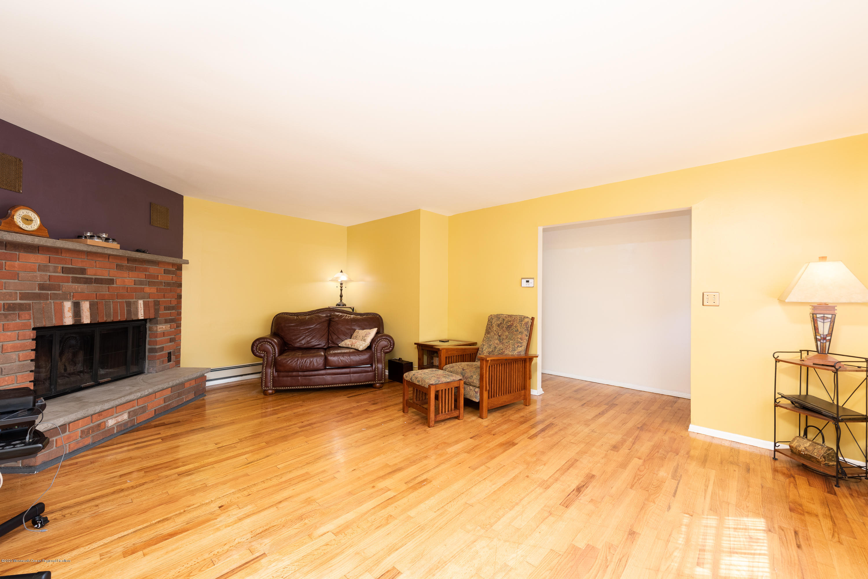 573 Holmdel Road Hazlet, NJ 07730 - Photo 8 of 34 a living room with furniture and a fireplace