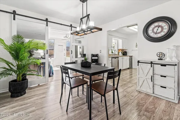 a kitchen with stainless steel appliances a refrigerator sink and microwave