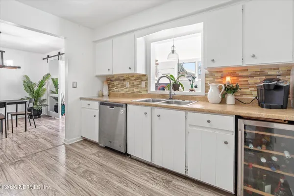 a kitchen with a sink and a window