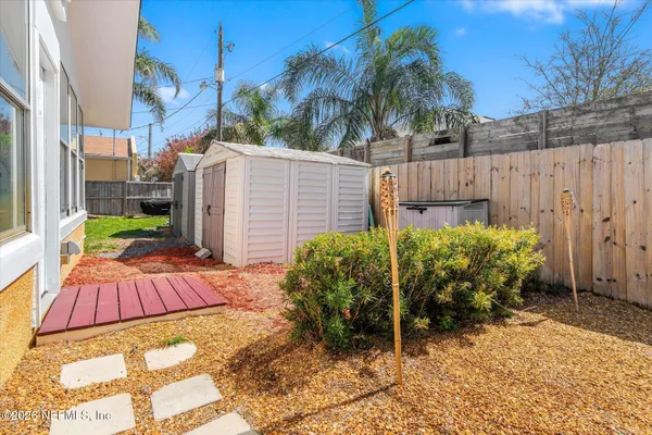 a view of a backyard of the house