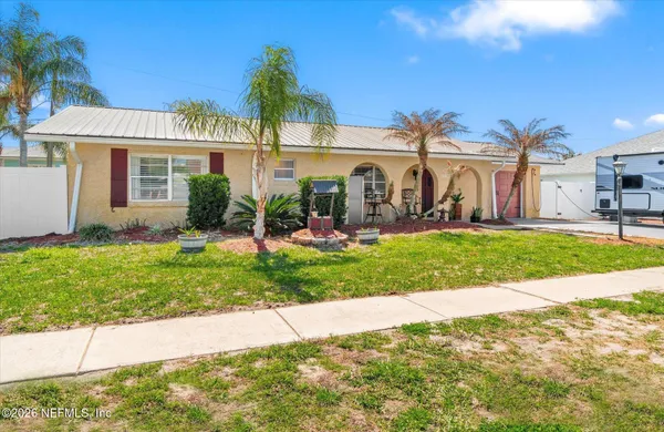 an aerial view of a house with a garden