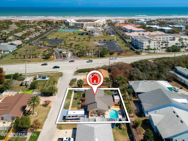 an aerial view of residential houses with outdoor space