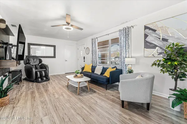 a living room with furniture and a flat screen tv