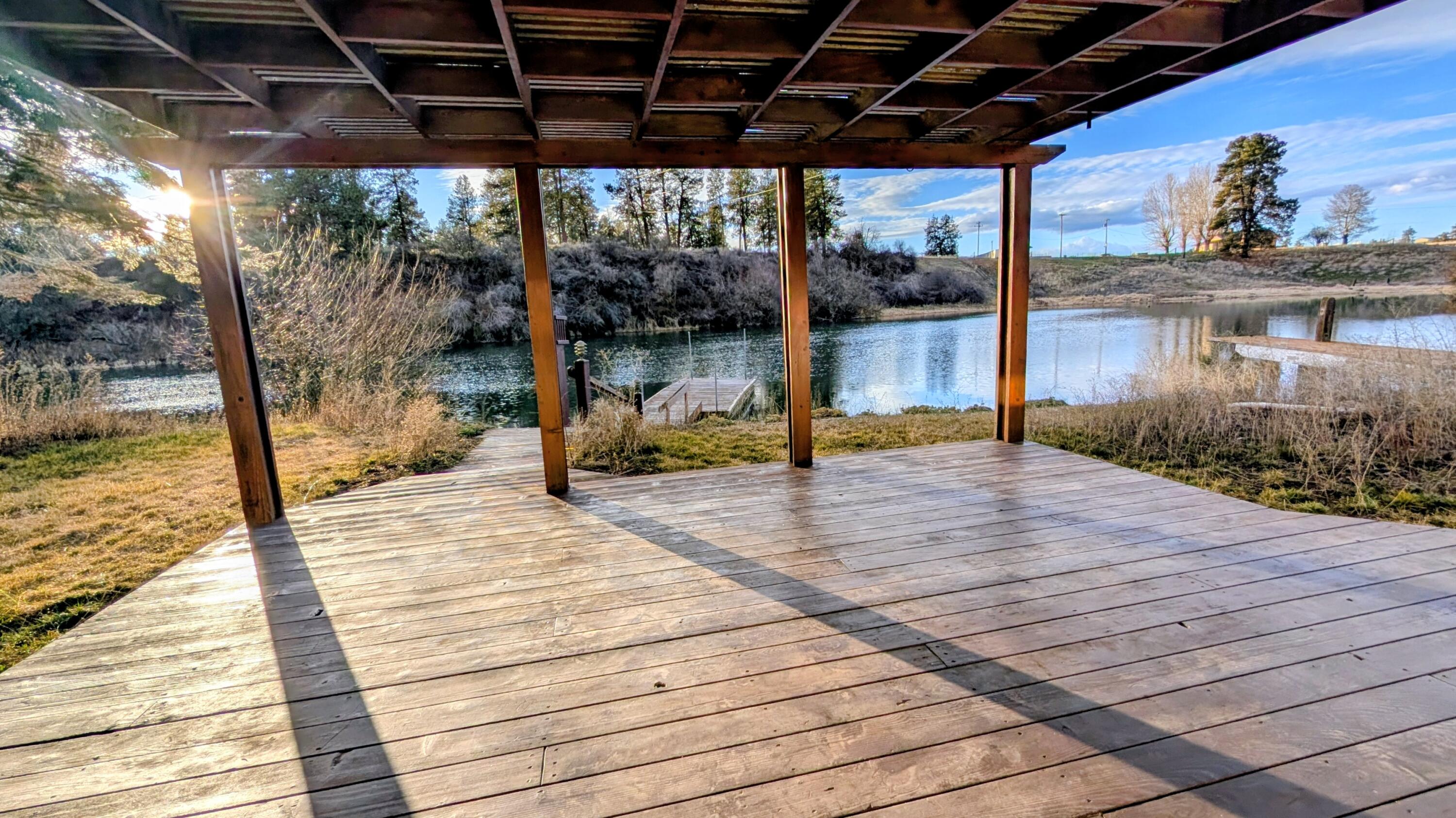32550 Rivers Drive Chiloquin, OR 97624 - Photo 17 of 24 a swimming pool with a bench and wooden floor