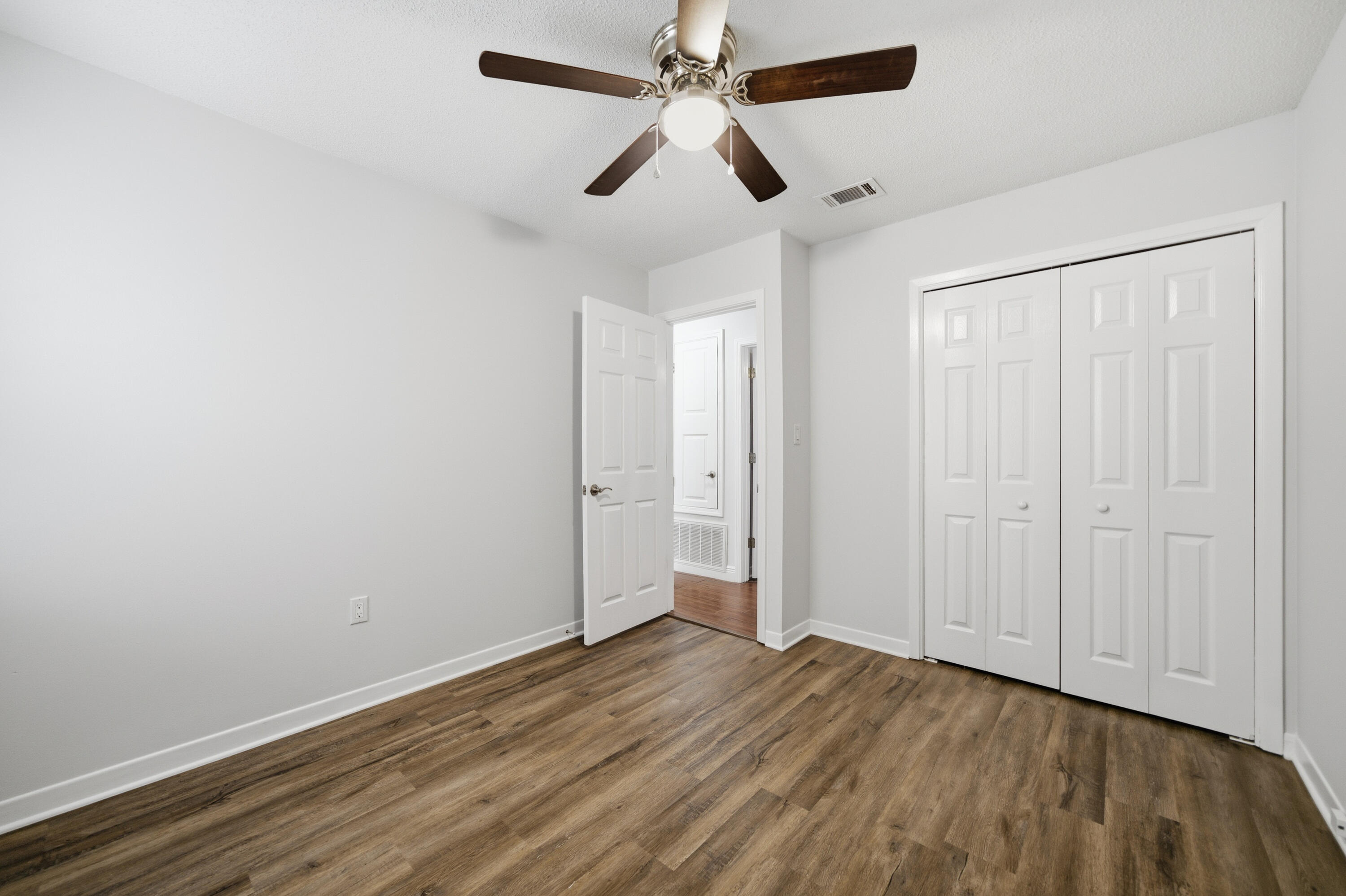 411 Ashley Drive Crestview, FL 32536 - Photo 25 of 44 wooden floor in an empty room