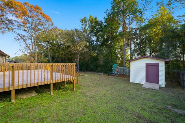 a backyard of a house with lots of green space