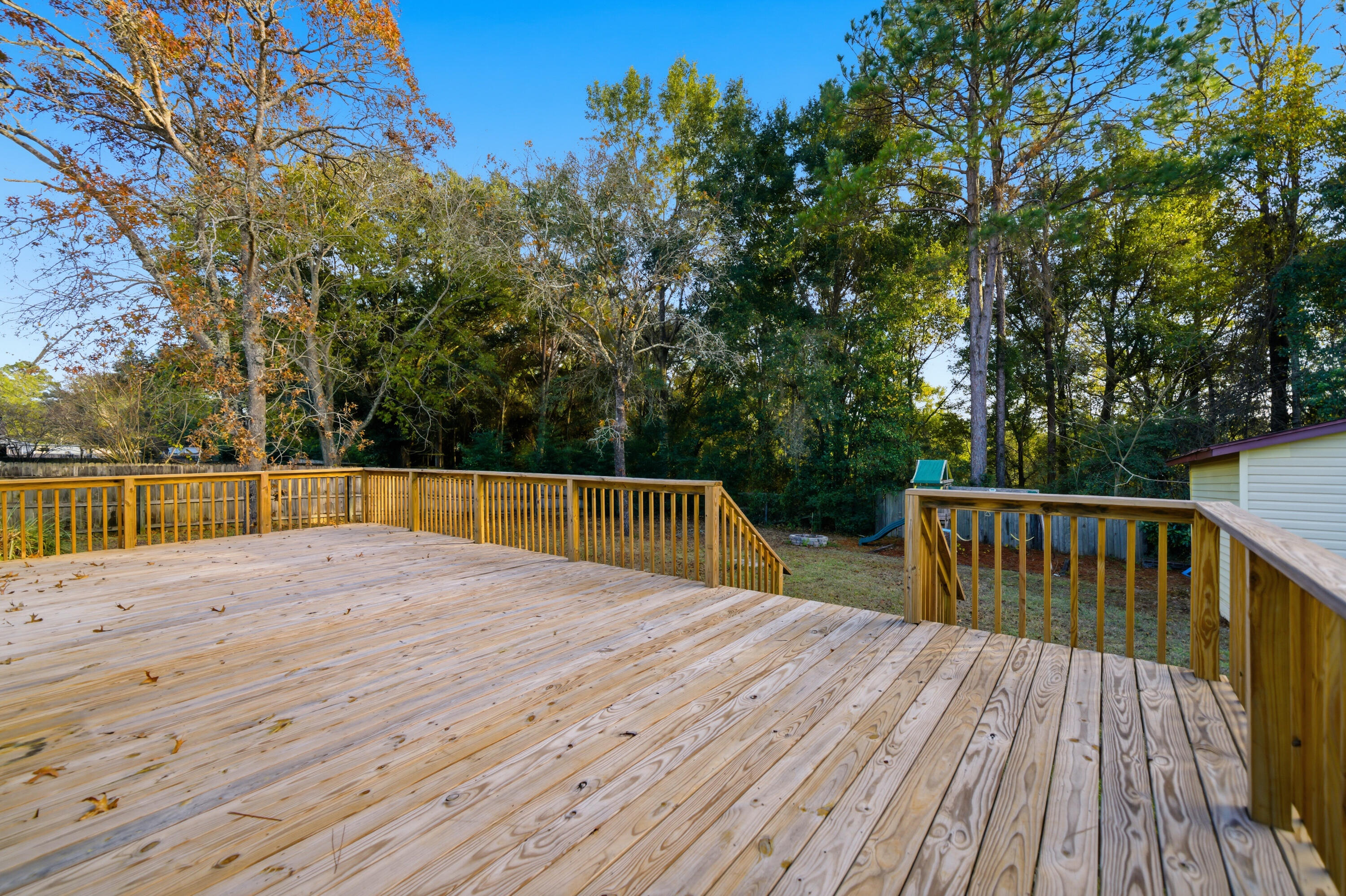 411 Ashley Drive Crestview, FL 32536 - Photo 39 of 44 a view of backyard with deck and trees