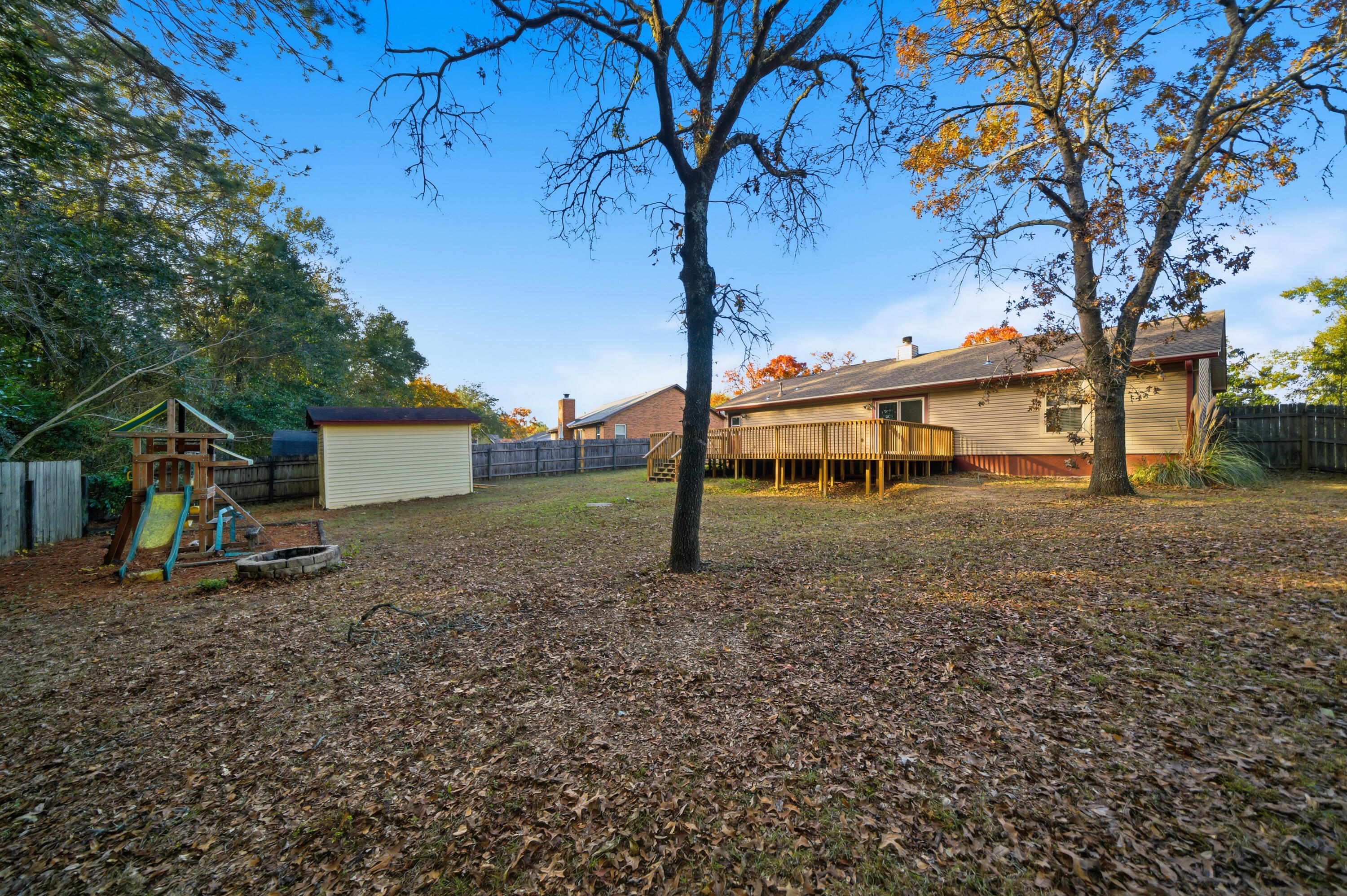 411 Ashley Drive Crestview, FL 32536 - Photo 41 of 44 a view of a house with a yard