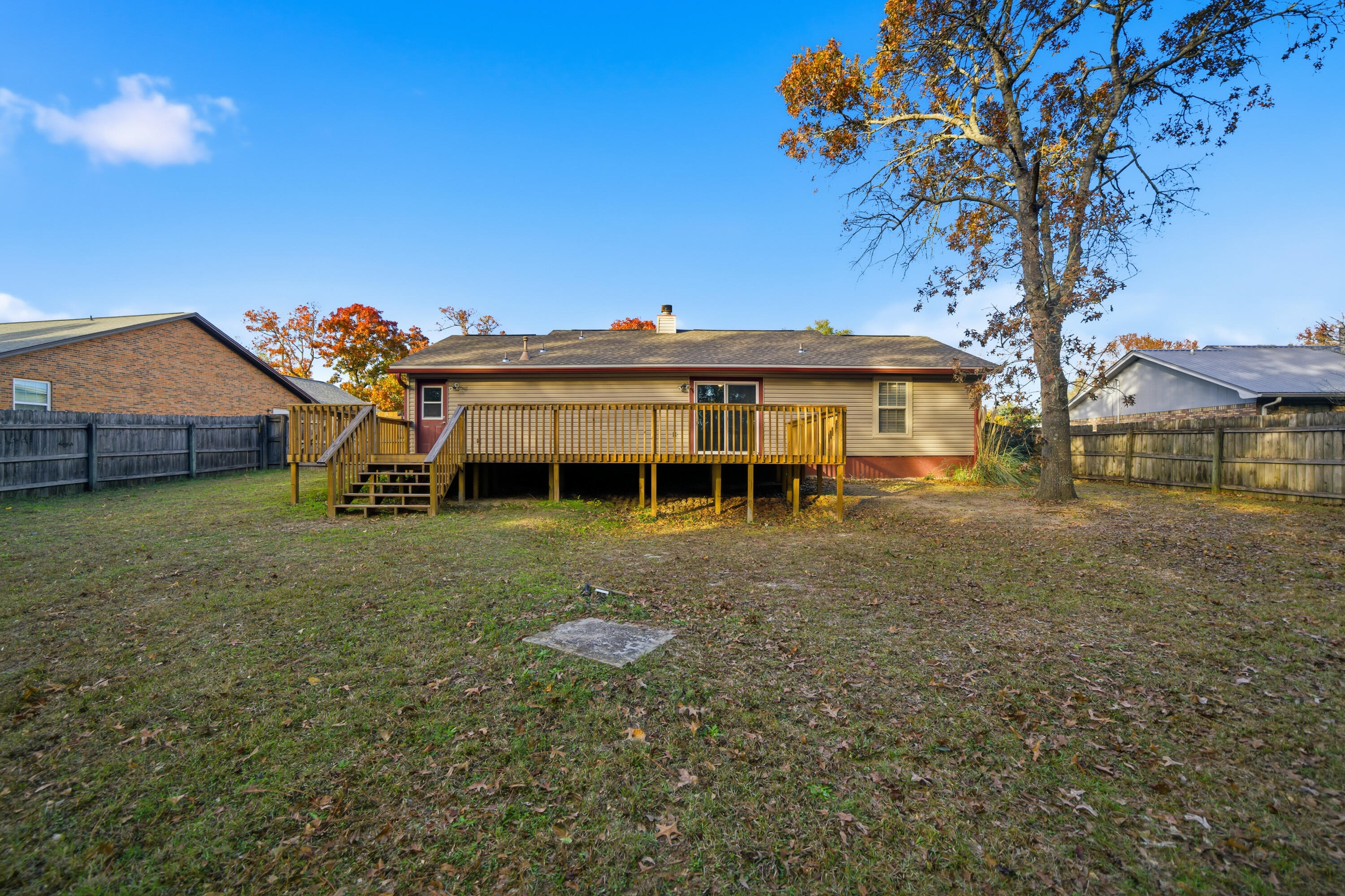 411 Ashley Drive Crestview, FL 32536 - Photo 43 of 44 a front view of a house with a garden