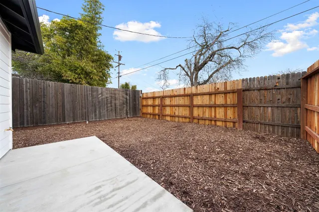 a view of a house with a yard and garage