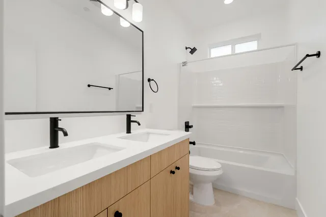 a view of backyard with wooden fence