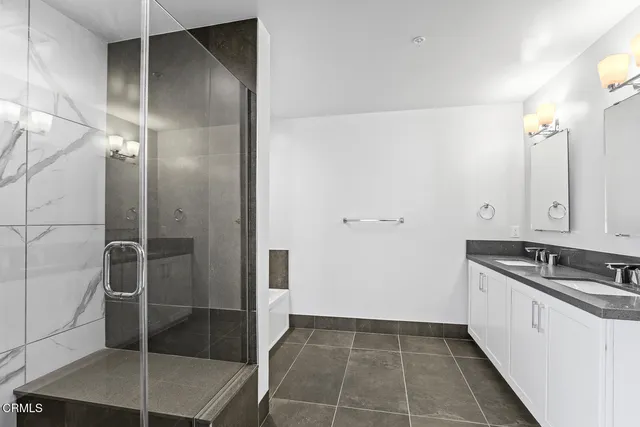 a kitchen with a sink and refrigerator