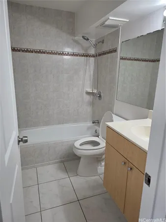 a bathroom with a toilet a sink and shower