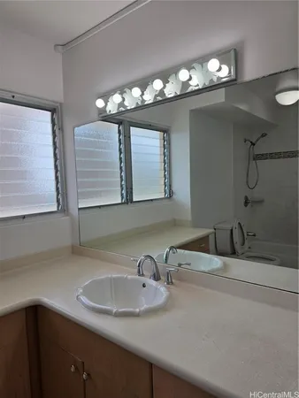 a view of a refrigerator and window in a room