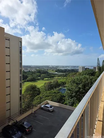 a view of balcony with yard and ocean view