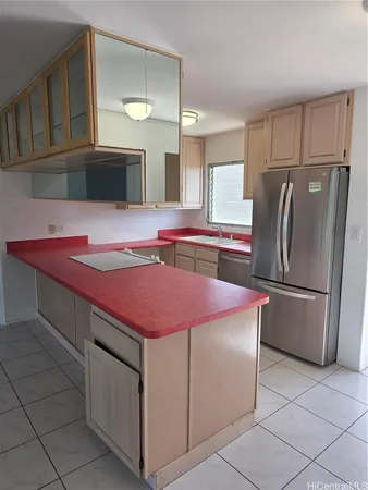 a kitchen with stainless steel appliances a refrigerator sink and cabinets