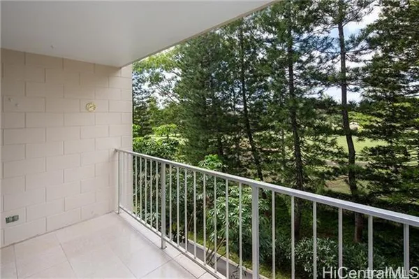 a view of a balcony with an outdoor space