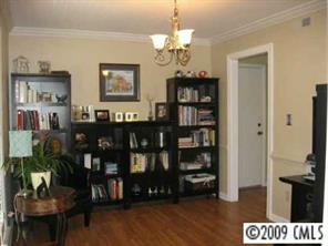 9734 Fairway Ridge Road Charlotte, NC 28277 - Photo 3 of 7 a view of a dining room with furniture and wooden floor