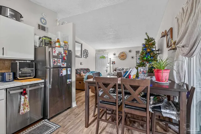 a view of a hallway with furniture and closet