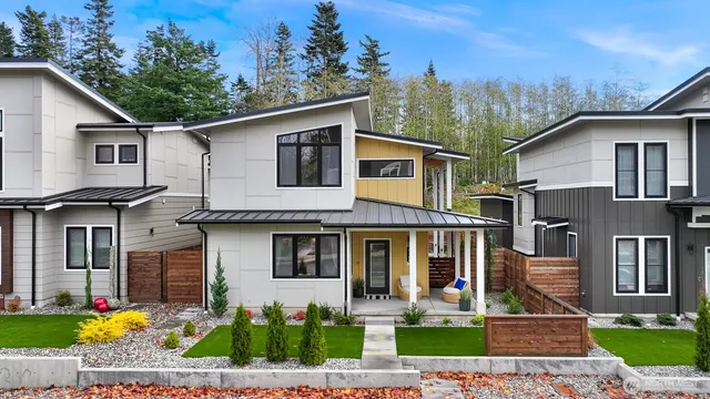 a front view of a house with garden