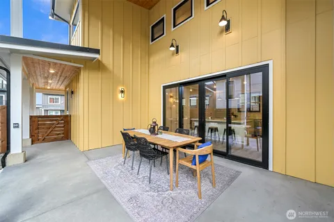 a outdoor space with a couch and chairs