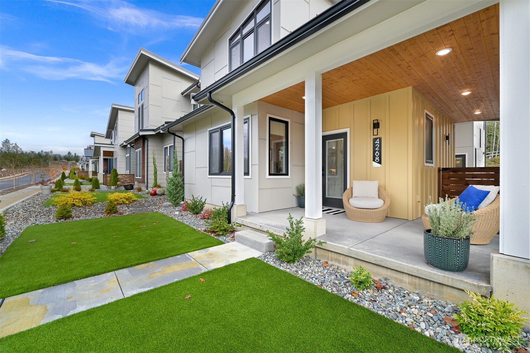 4268 Creston Way Bellingham, WA 98226 - Photo 2 of 40 a front view of a house with a garden and yard