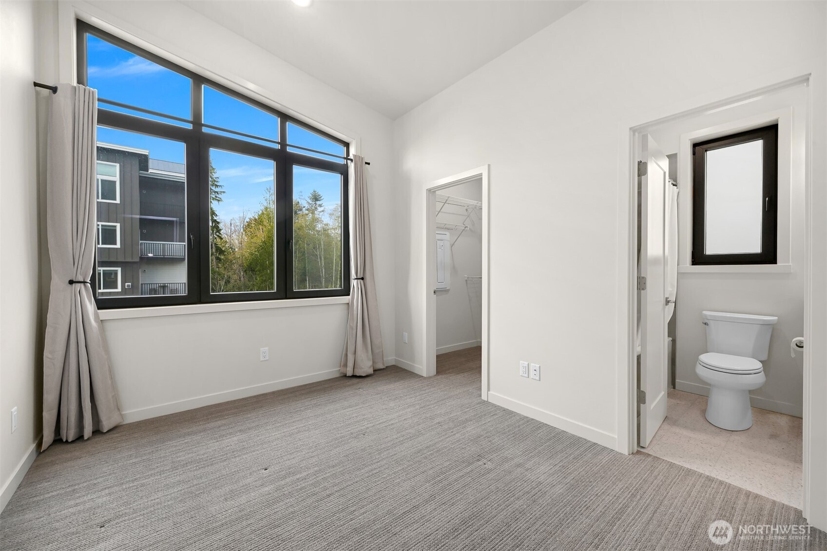 4268 Creston Way Bellingham, WA 98226 - Photo 27 of 40 a view of a hallway with wooden floor and a bathroom