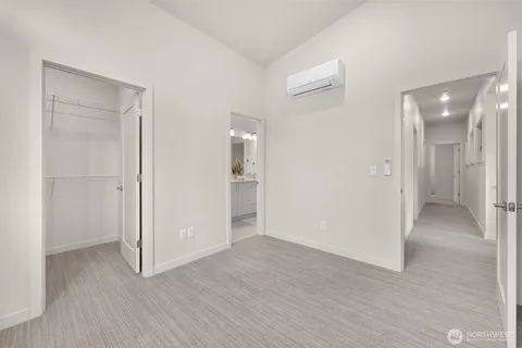 a view of an empty room and wooden floor