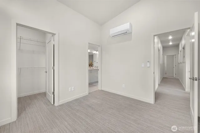 a view of an empty room and wooden floor