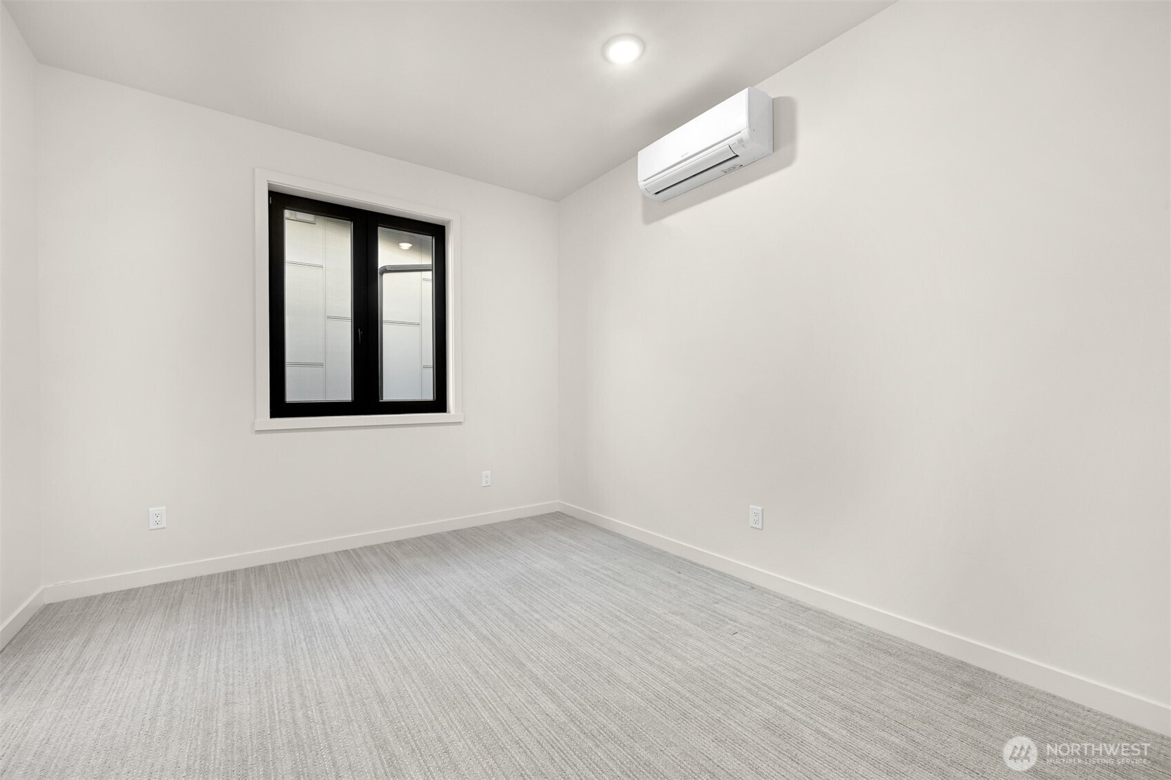 4268 Creston Way Bellingham, WA 98226 - Photo 32 of 40 an empty room with wooden floor and windows