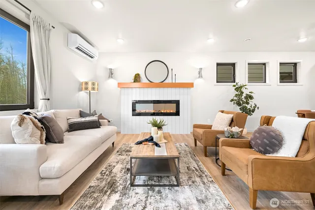 a living room with furniture fireplace and a fireplace