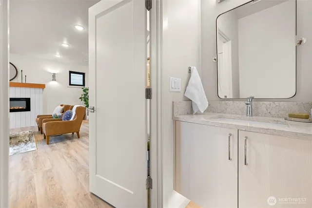 a en suite bathroom with sink and mirror