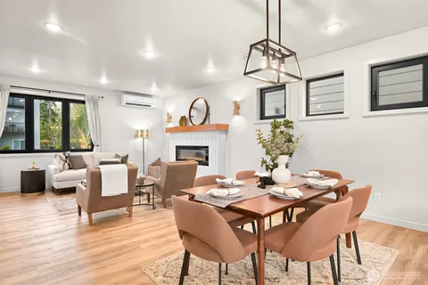 a view of a dining room with furniture window and wooden floor
