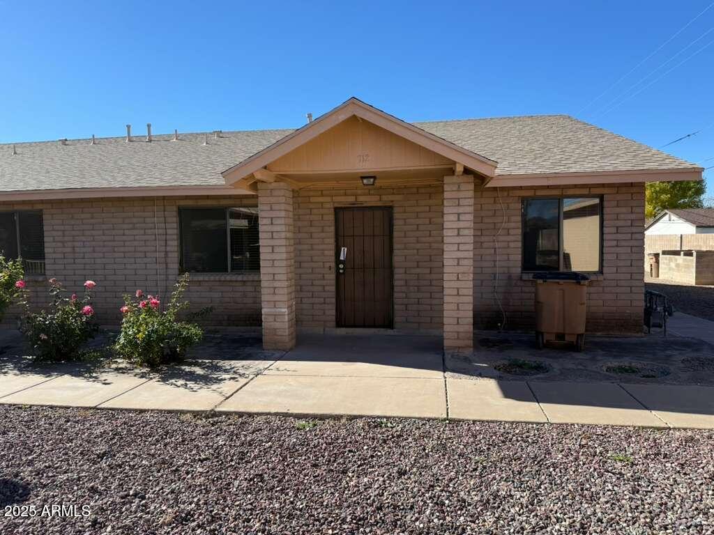 712 East 17th Street, Unit B Douglas, AZ 85607 - Photo 1 of 20 a front view of a house with garden