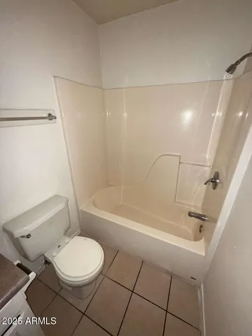 a bathroom with a toilet a sink and bathtub